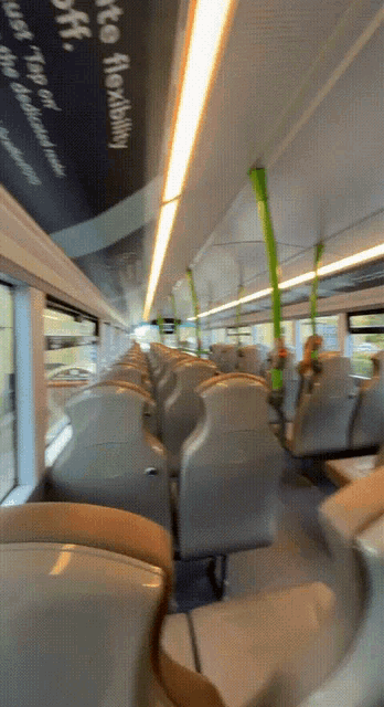 the inside of a bus with a sign on the ceiling that says ' auto flexibility '