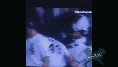 a group of baseball players are on a television screen and one of them has the number 43 on his jersey