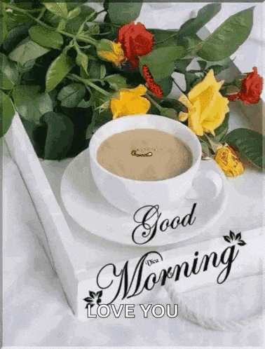 a cup of coffee is sitting on a saucer next to a bouquet of flowers on a tray .