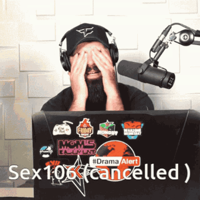 a man wearing headphones is covering his face in front of a laptop that says sex 106 canceled