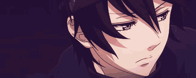 a close up of a person 's face with a serious look on their face