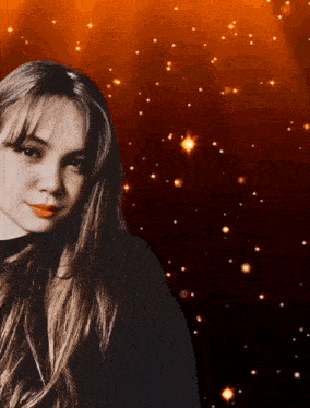 a woman with long hair is standing in front of a red background with stars