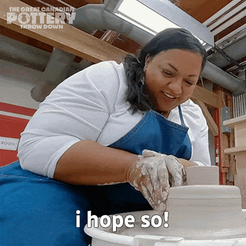 a woman sitting on a pottery wheel with the words i hope so