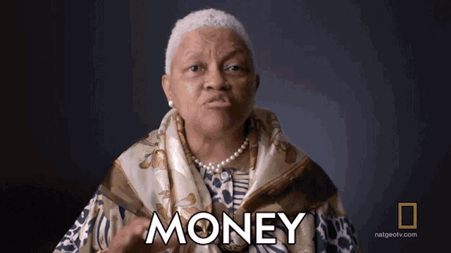 an older woman with a scarf around her neck says money in front of a national geographic logo