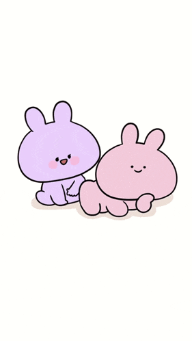 a purple and a pink bunny are sitting next to each other