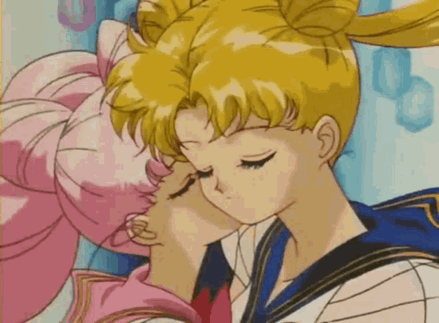 sailor moon and chibi moon are kissing in a cartoon