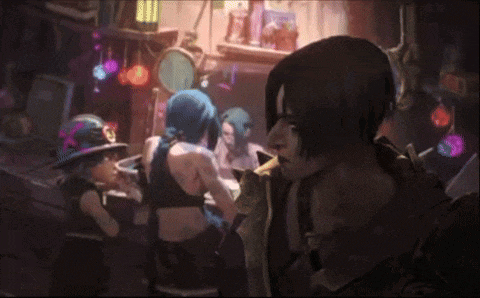 a group of people are standing in a room and one of them is wearing a cowboy hat