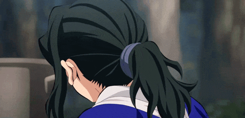 a person with long black hair is wearing a blue shirt and ponytail