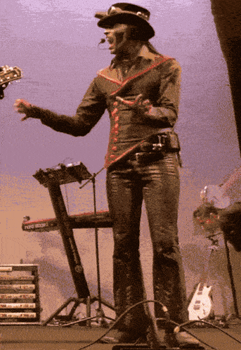 a person standing in front of a keyboard that says ' fender ' on it