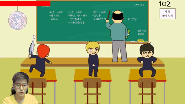 a man in a yellow shirt is sitting in front of a classroom with a blackboard that says 102