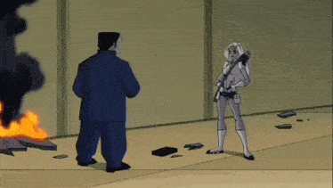 a cartoon of a man and a woman standing in front of a burning building