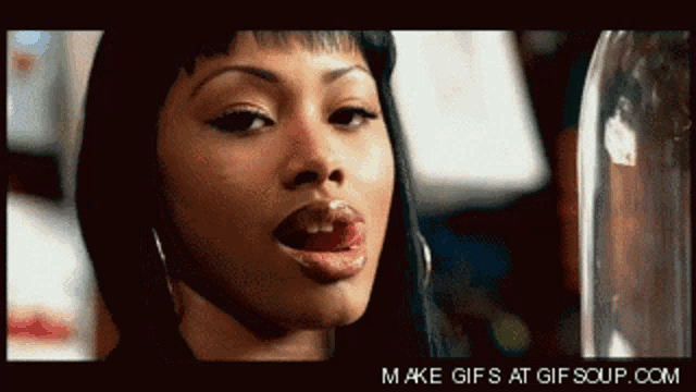 a gif of a woman sticking her tongue out is displayed on gifsoup.com