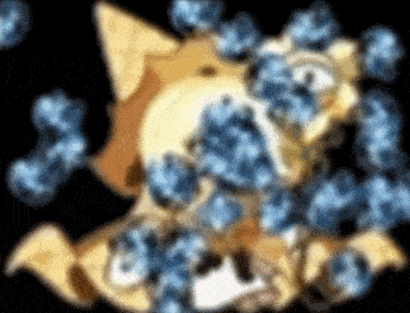 a blurry picture of a cat surrounded by blue flowers .