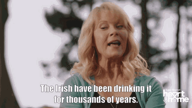 a woman says " the irish have been drinking it for thousands of years " in front of trees