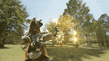 a man in a cowboy outfit holds a gun in a park
