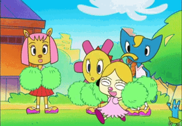 a group of cheerleaders are standing in a park