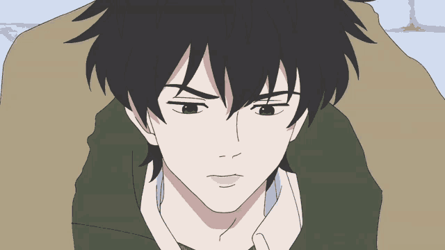 a close up of a person 's face with a serious look on his face