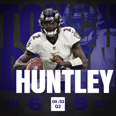 a football player named huntley is holding a football
