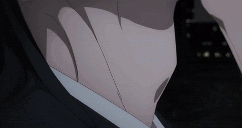 a close up of a man 's neck and chest in a suit
