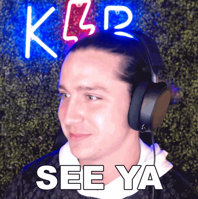 a man wearing headphones says " see ya "