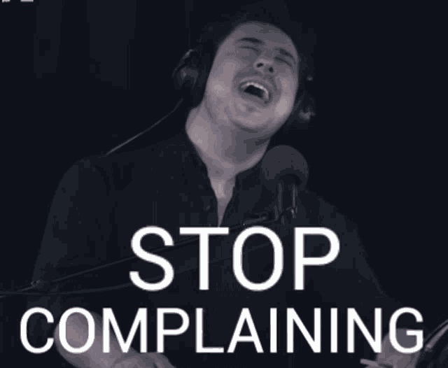 a man wearing headphones singing into a microphone with the name megan on the bottom
