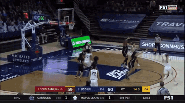 a basketball game between south carolina and uconn is being shown on fs1