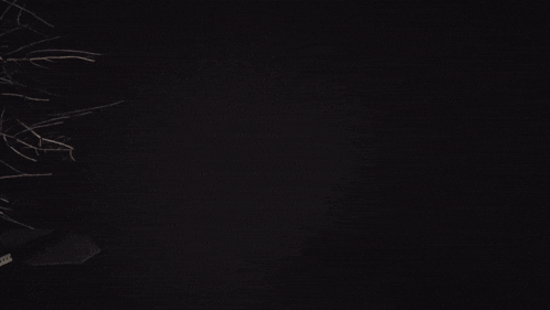 a close up of a man 's face with a light in the background