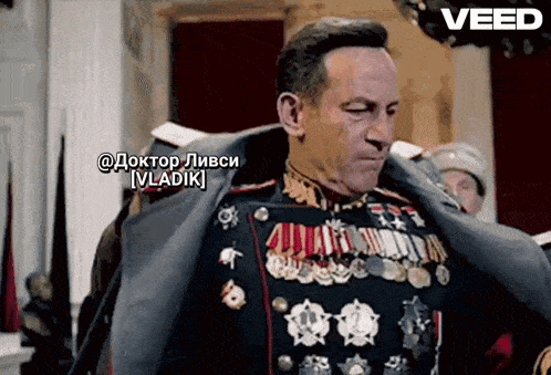 a man in a military uniform with a caption that says vladik on it