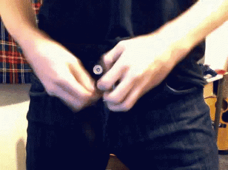 a close up of a person 's waist with a button on it .