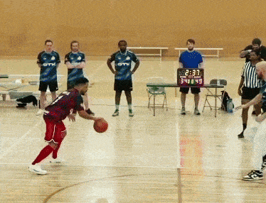 a basketball game is being played with a scoreboard showing the time as 2:33