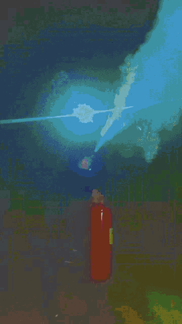 a man is holding a red fire extinguisher while standing next to another man