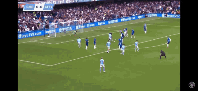 a soccer game is being played in front of a banner that says born is the king on it