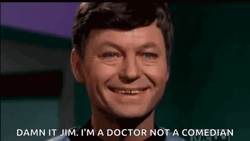a man is smiling and saying damn it jim i 'm a doctor not a comedian .