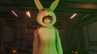 a girl in a bunny costume holds a gun