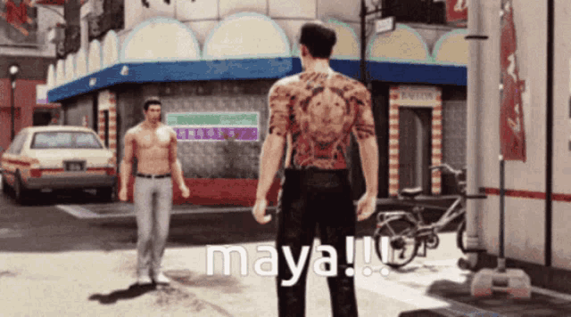 a man with a tattoo on his back stands in front of maya