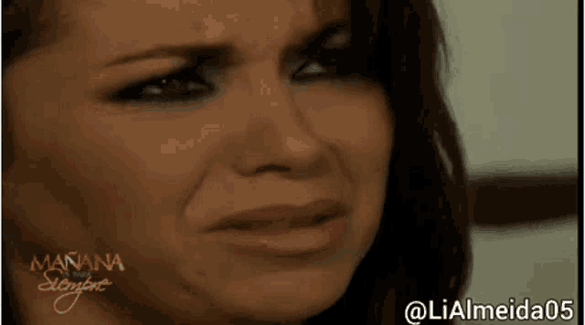 a close up of a woman 's face with the words manana siempre written on the bottom