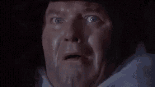 a close up of a man 's face with the words oh my god written on it
