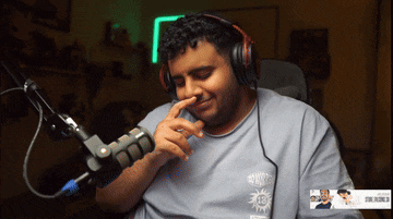 a man wearing headphones and a shirt that says 13 on it