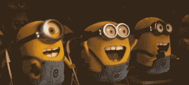 a group of minions with one wearing a blue shirt that says ' io ' on it