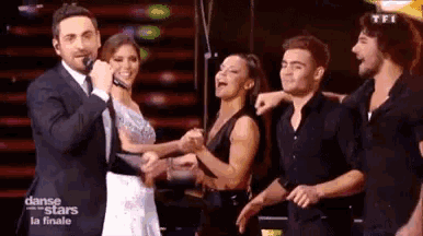 a group of people on a stage with the words danse stars on the bottom