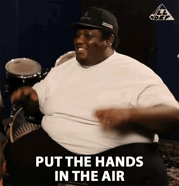 a man playing drums with the words put the hands in the air