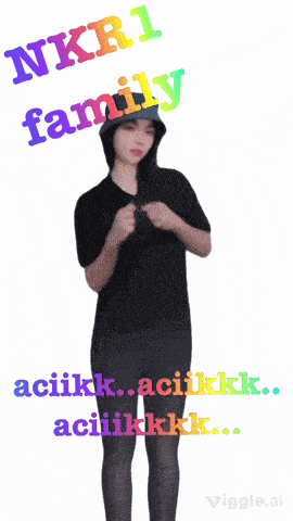 a woman in a black shirt is dancing with the words nkr1 family behind her