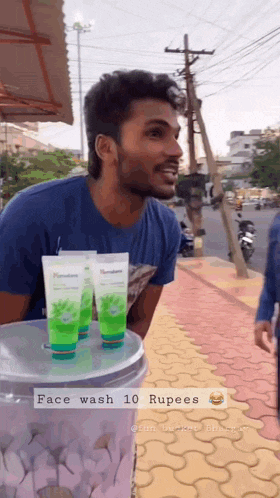 a man selling face wash for 10 rupees on the sidewalk