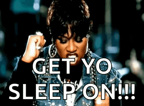 a woman with her fist in the air says get yo sleep on !!!