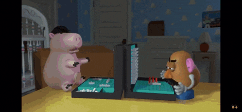 mr potato head is playing a board game with a pig
