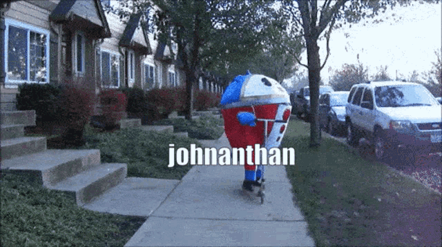 a person in a johnathan costume is riding a scooter down a sidewalk