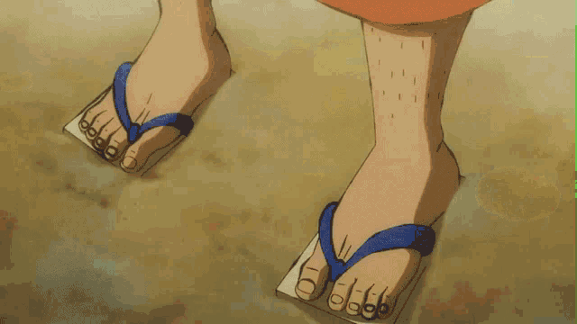 a close up of a person 's feet wearing flip flops with numbers on them
