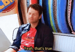 a man is sitting on a couch with his eyes closed and says " yeah that 's true "
