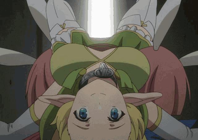 a girl with blue eyes is laying on her back with her head down