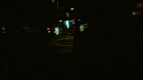 a blurry picture of a city street with a sign that says ' chinese restaurant '